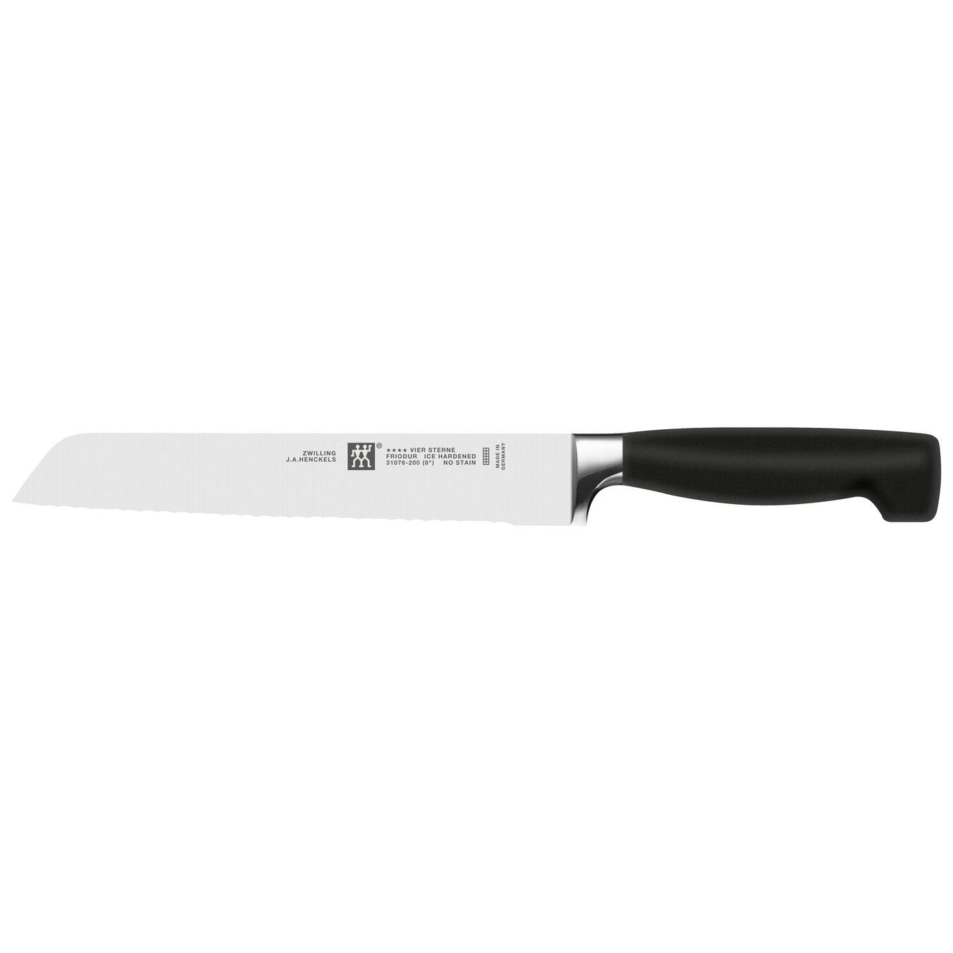 serrated bread knife with black handle on white background