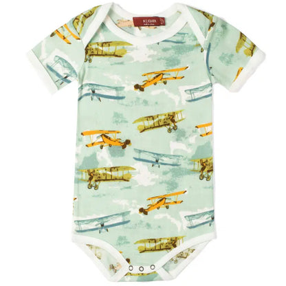 light blue onsie with all-over pattern of vintage airplanes.