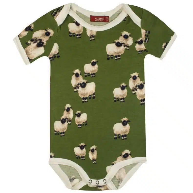 green onsie with all-over pattern of sheep.