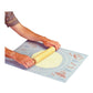 illustration of a person using the kitchen helper pastry mat with a rolling pin and flattened pastry on a white background