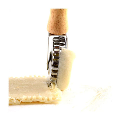 pastry crimper cutting and crimping dough.