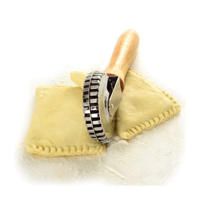 top view of pastry crimper with fresh ravioli.