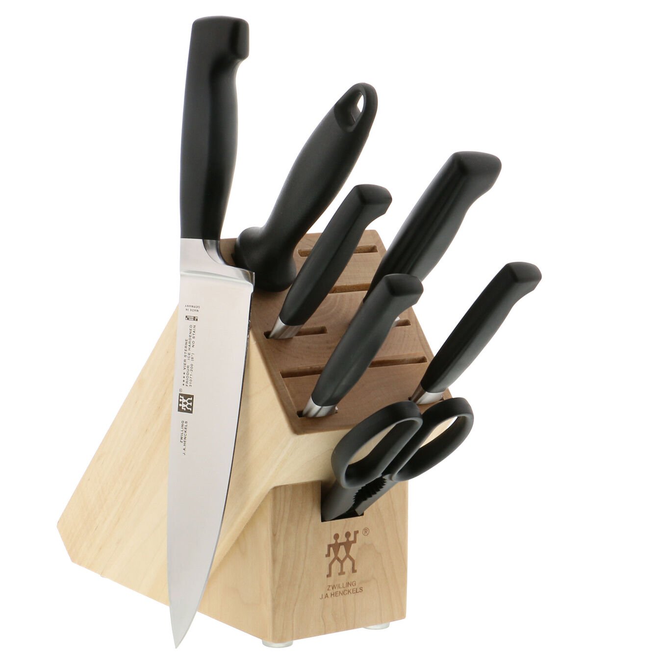 wooden knife block filled with knives and one knife outside block on white background