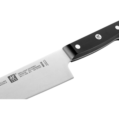 close up of chef's knife on white background
