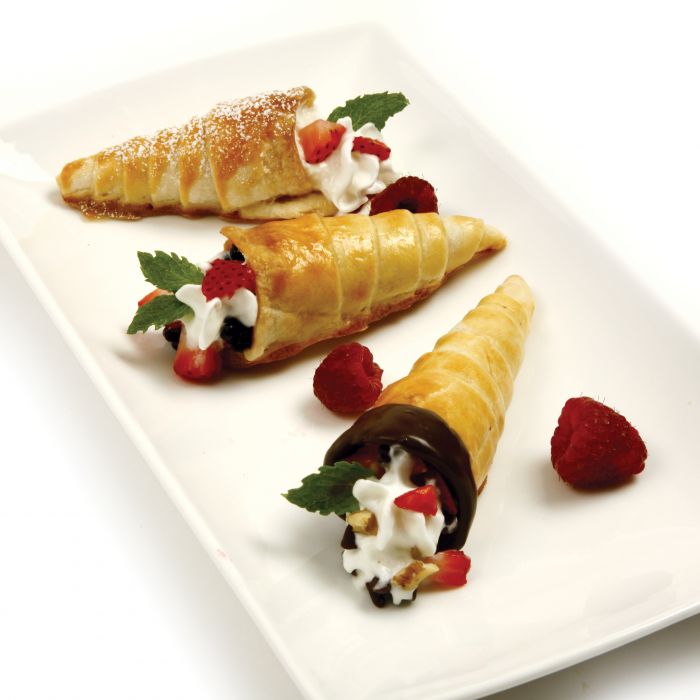 cream horns filled with cream, chocolate, and berries.