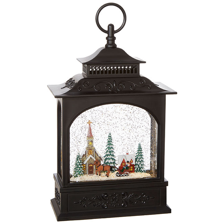 antique bronze finifshed lantern filled with water, glitter, and a town scene.