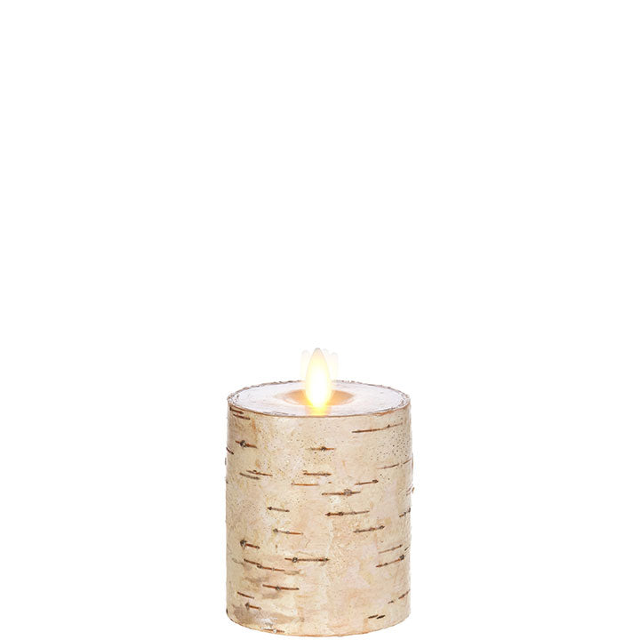 small tan moving flame birch wrapped pillar candle against a white background