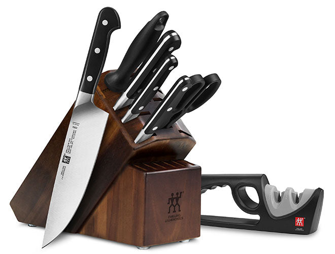 knife block with knives and sharpener on a white background