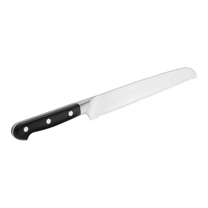 reverse side of bread knife on white back ground