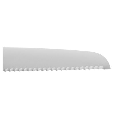 close up of serrated blade on white background