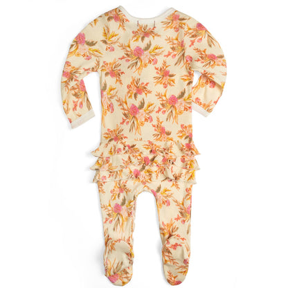 back view of cream footed sleeper with all-over floral pattern and ruffles on the bootie.