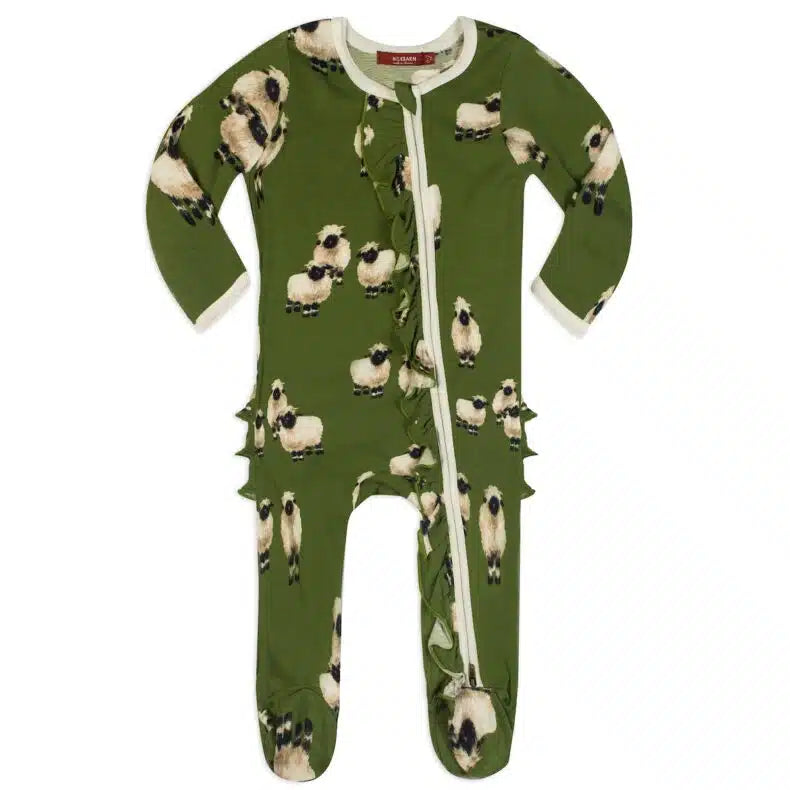 green footed romper with all-over pattern of sheep.