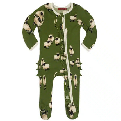 green footed romper with all-over pattern of sheep.