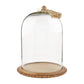large glass cloche with tassel on a white background
