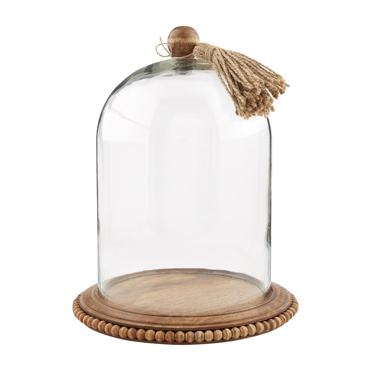 small glass cloche with tassel on a white background