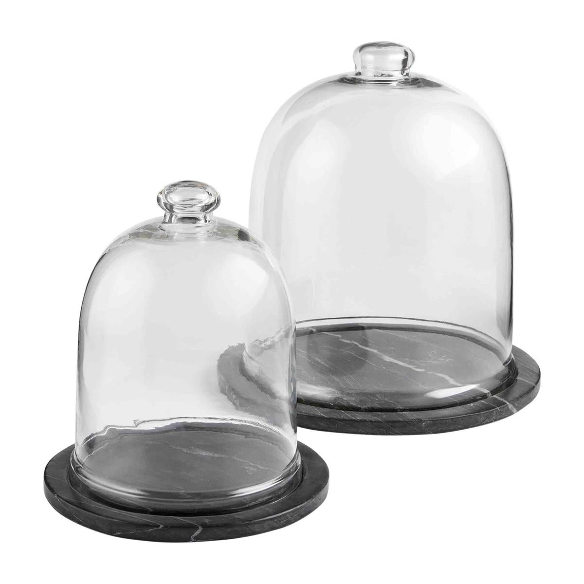 small and large black marble cloches against a white background