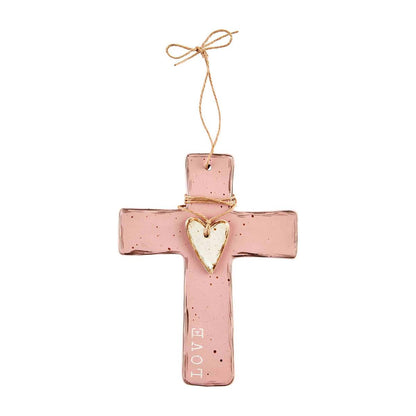 pink cross with white heart and :love" along the side against a white background