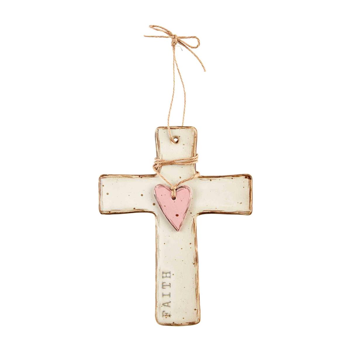 white cross with pink heart  and "faith" along the side against white background