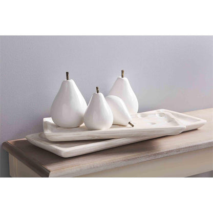 multiple ceramic pear sitters displayed on two rectangle wooden trays resting on a light wood hall table