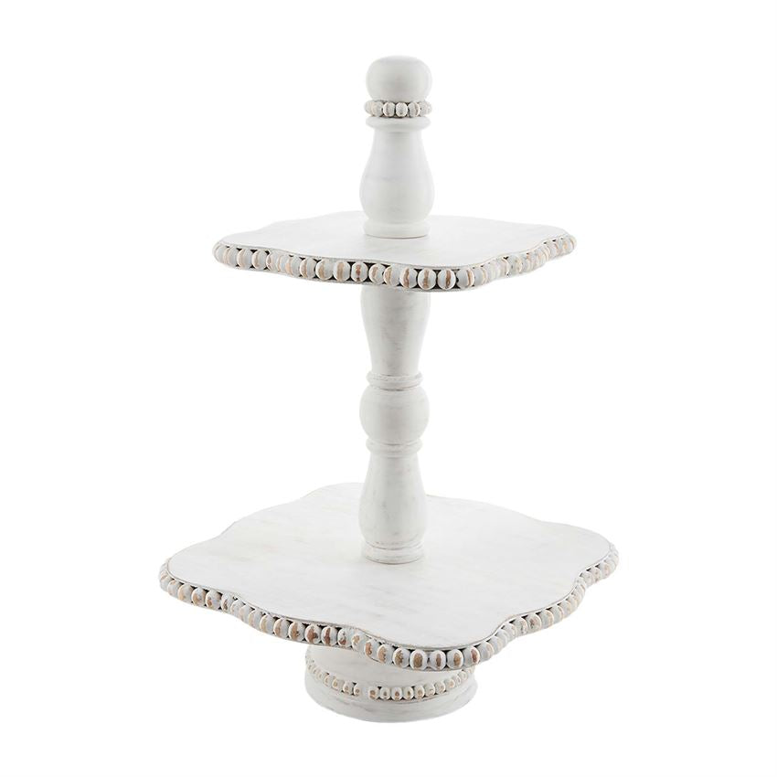 white beaded two tier stand displayed against a white background