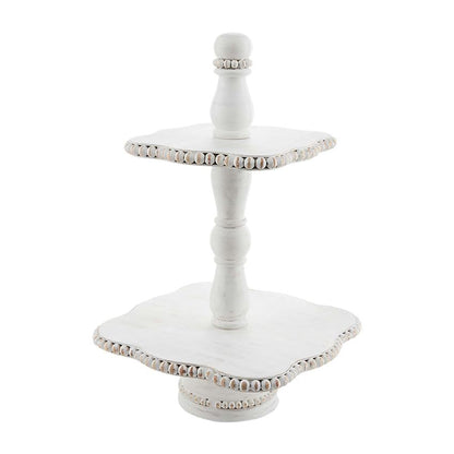 white beaded two tier stand displayed against a white background
