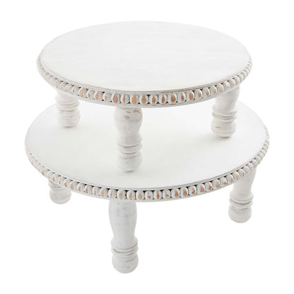 small and large beaded pedestals stacked on a white background