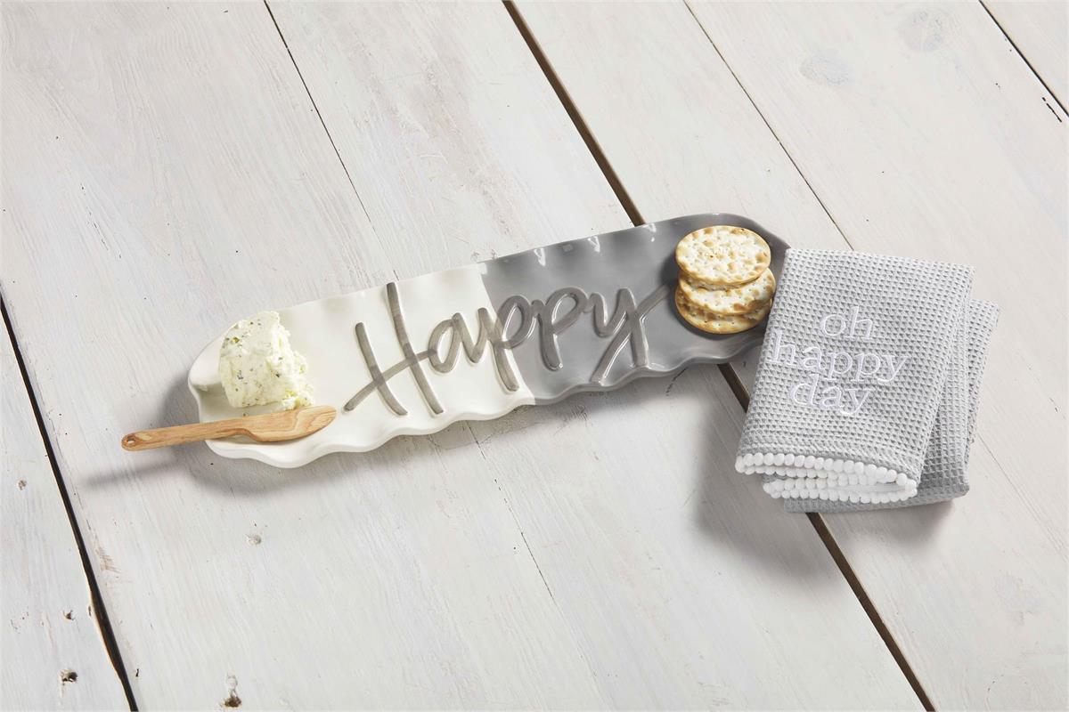 happy hostess set displayed next to a folded towel with crackers and cheese ball on a light gray wood slat surface