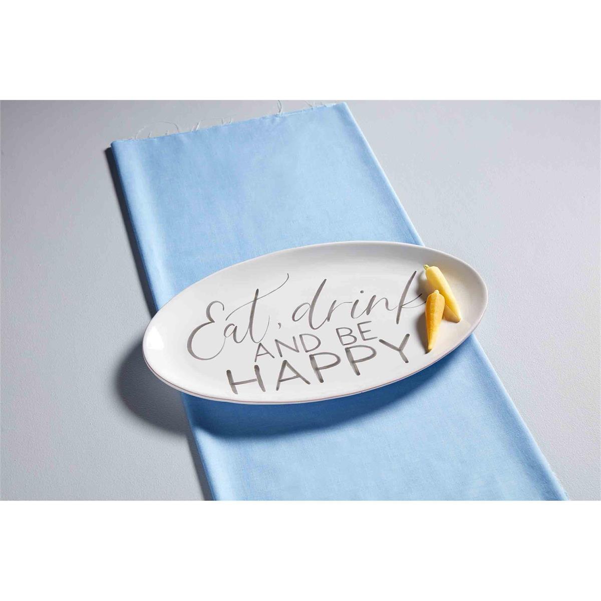 eat drink and be happy platter displayed on a light blue towel with two yellow peppers resting on it