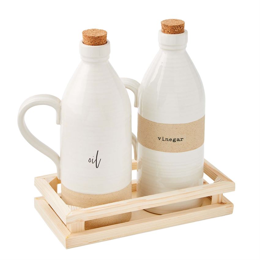 oil and vinegar bottles displayed in the wood tray on a white background