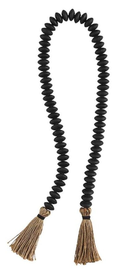 black tassel decor beads on a white background