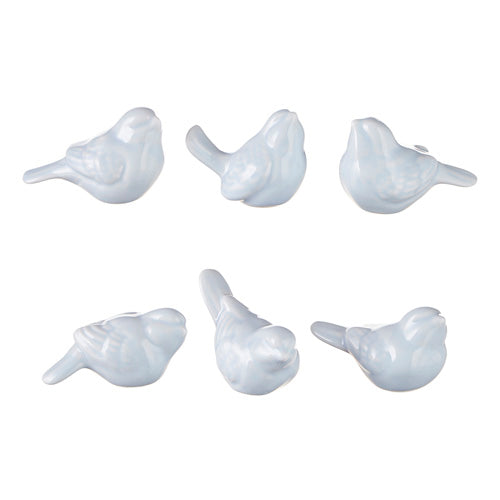 6 assorted white ceramic birds in various poses on a white background.