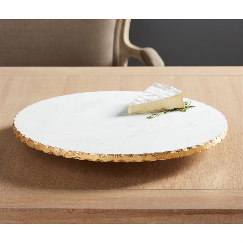marble lazy susan displayed with a corner of cheese on a table