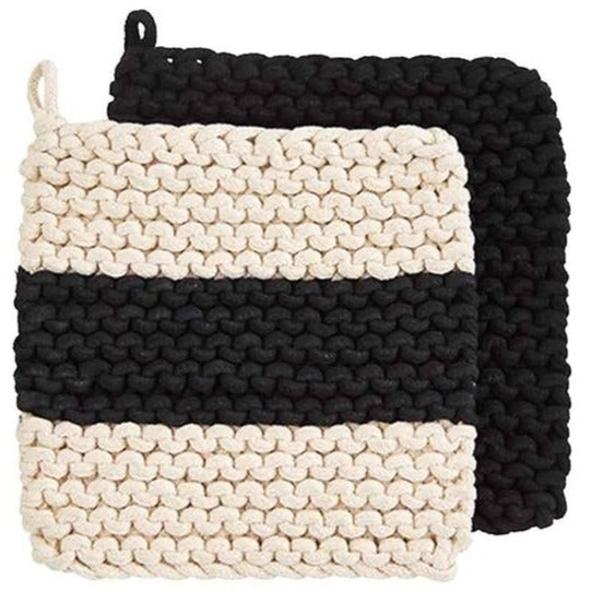 over lapping crocheted pot holders, one solid black, the other cream with a center black stripe.