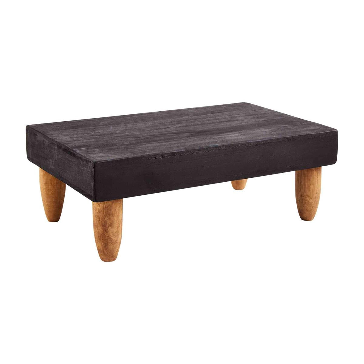 black footed serving board has natural wood legs agaisnt a white backgrounnd