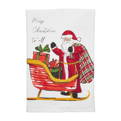 white towel with graphic of santa with fair skin tone standing next to his sleigh filled with gifts and the text "merry christmas to all".