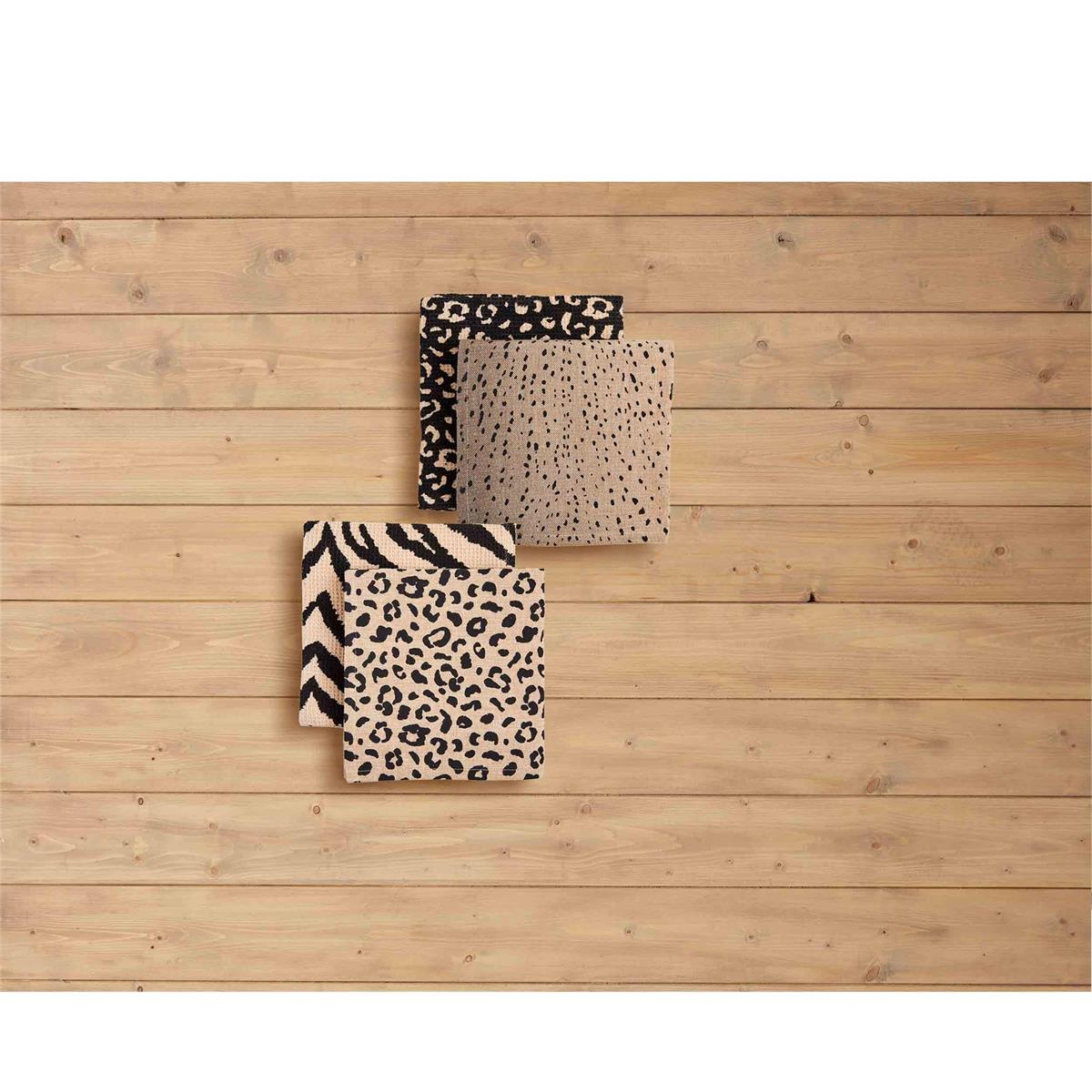 both styles of animal print towels displayed on a light stained shiplap background