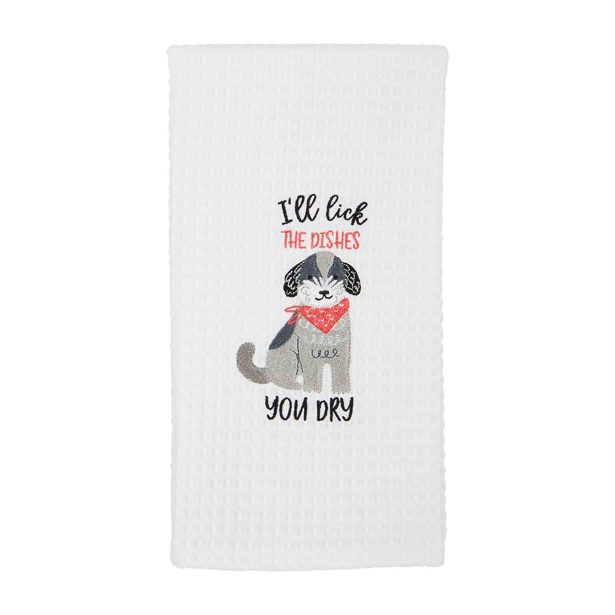 white dish towel with embroidered dog and "i'll lich the dishes you dry" embroidered on it.