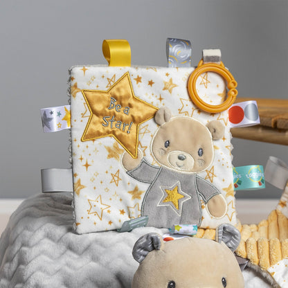 be a star crinkle toy displayed on a blanket next to the be a star toy against a gray background