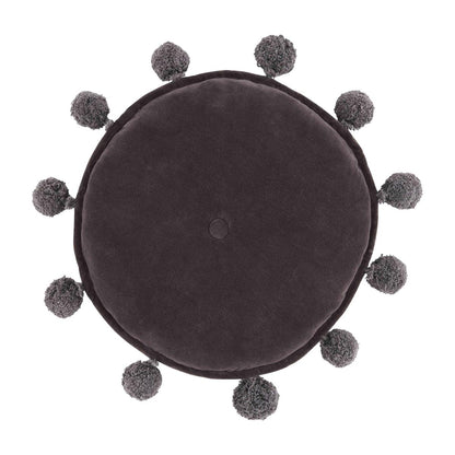 dark grey round pillow with yarn poms around the circumference.