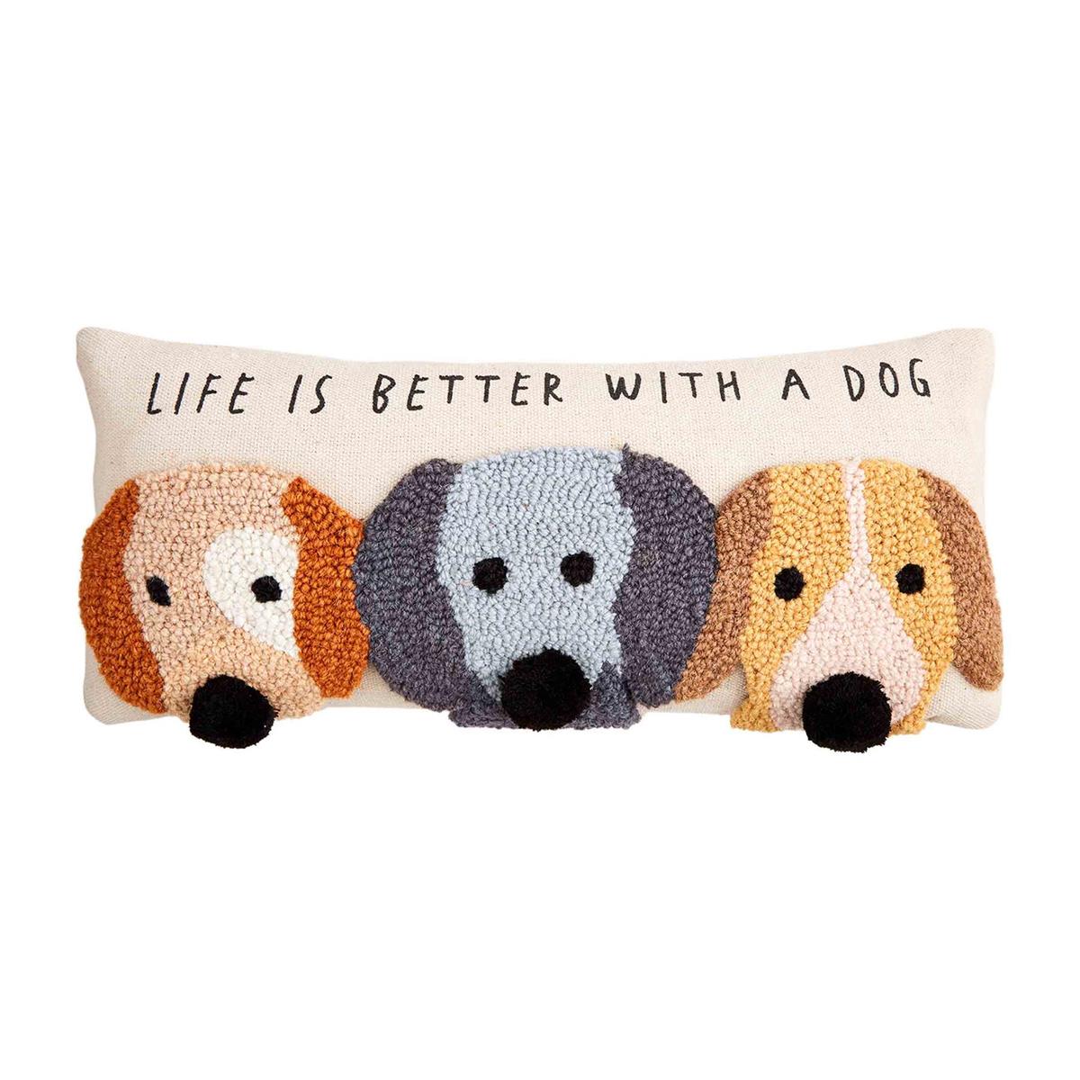 cream colored pillow with 3 dog face and text "life is better with a dog" on it.