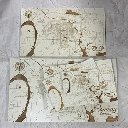 ivory burnt wood map of conway displaying five sizes on a white background