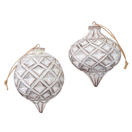 2 wooden ornaments with geometric designs and a white-washed finish.