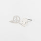 silver peace sign stud earrings on a white background