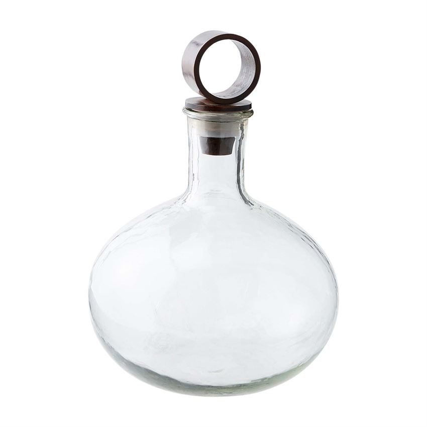 textured glass decanter on a white background