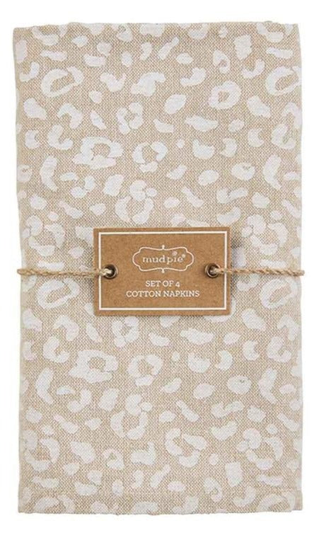 natural chambray napkin with white cheetah print tied with mudpie label.