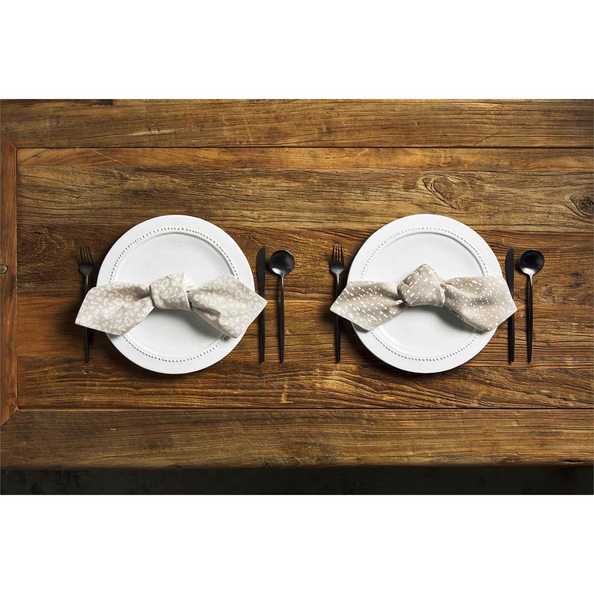 2 place settings on a wooden tabletop includes plates, napkins, and silverware.