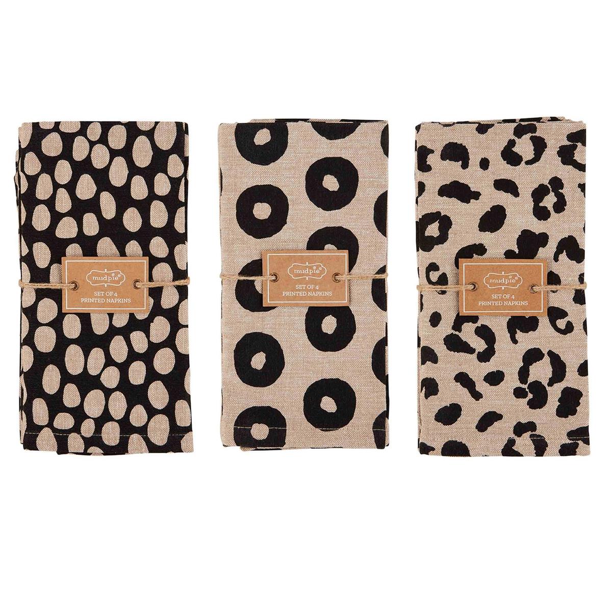 all three styles of animal print napkins folded and wrapped with twine on a white background
