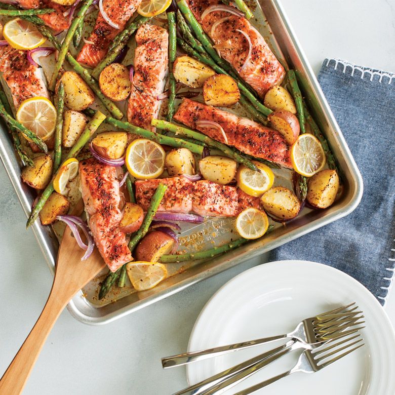 half sheet pan filled with fish and asparagus.