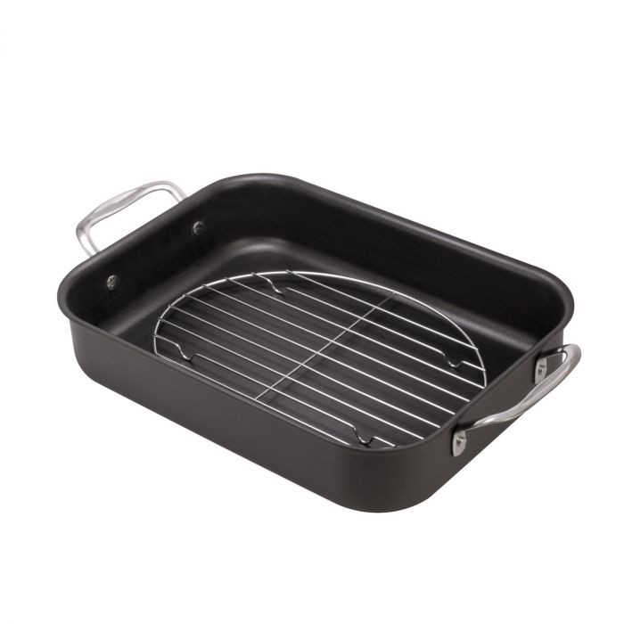 the oval roasting rack in a roasting pan on a white background