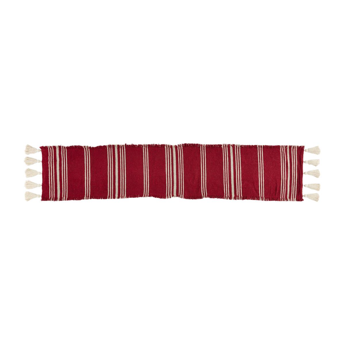 red and cream striped runner with cream tassels on the ends.